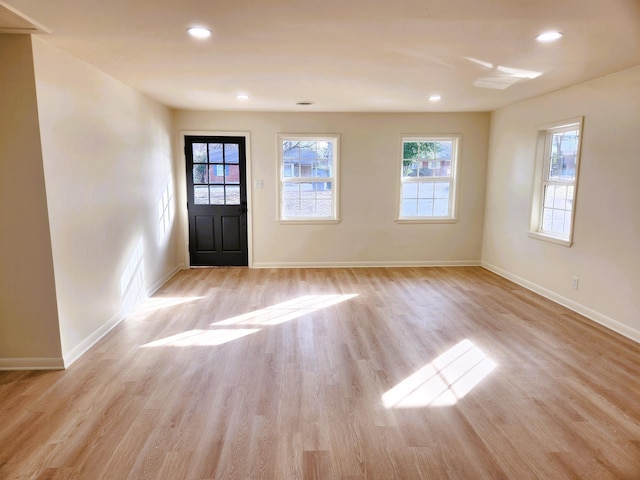 foyer entrance with light wood-type flooring