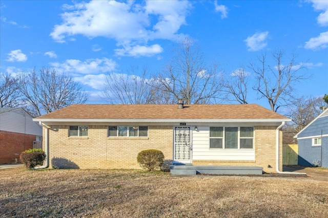 back of property featuring a yard