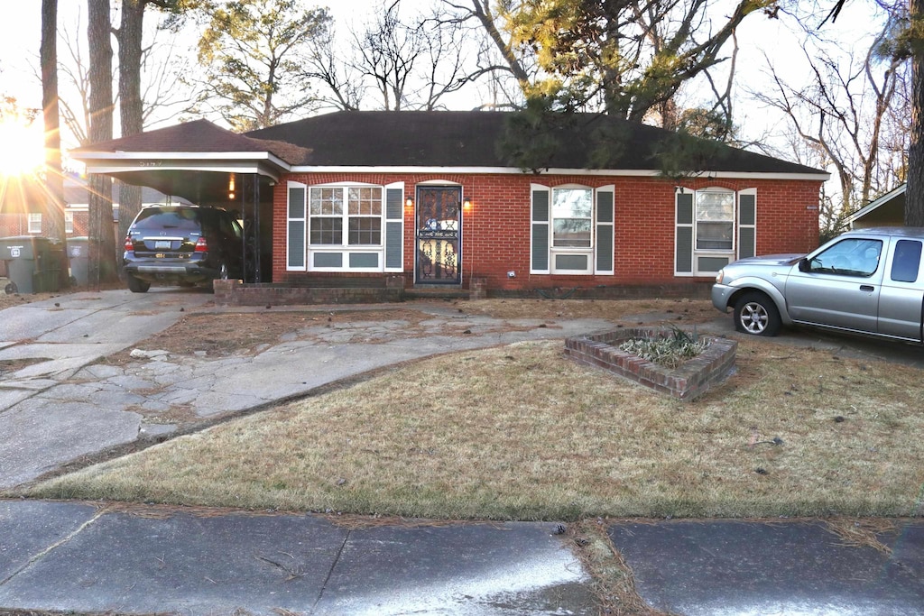 single story home featuring a carport