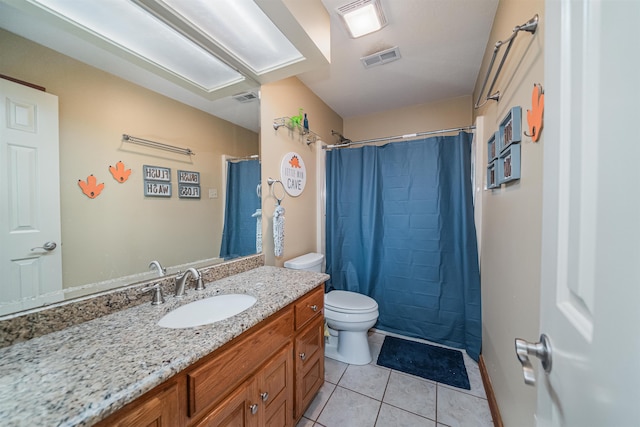 bathroom with vanity, toilet, tile patterned floors, and curtained shower