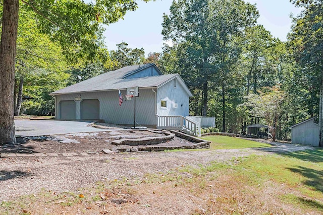 exterior space with a garage and a yard