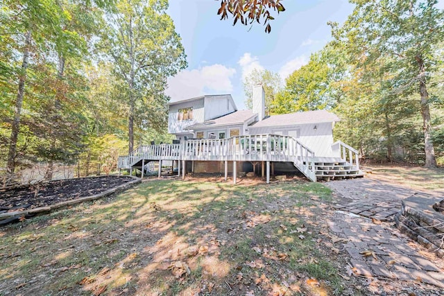 back of house with a wooden deck