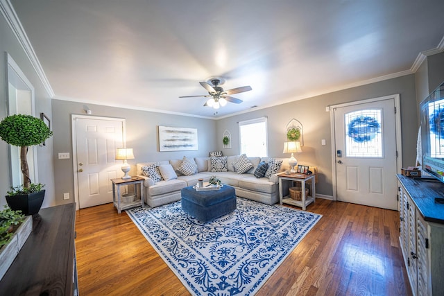 living room featuring crown molding, ceiling fan, and dark hardwood / wood-style flooring