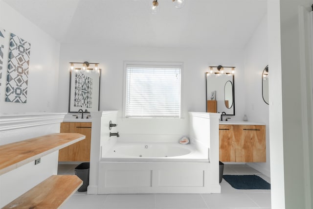 bathroom with a tub, tile patterned floors, vanity, and lofted ceiling