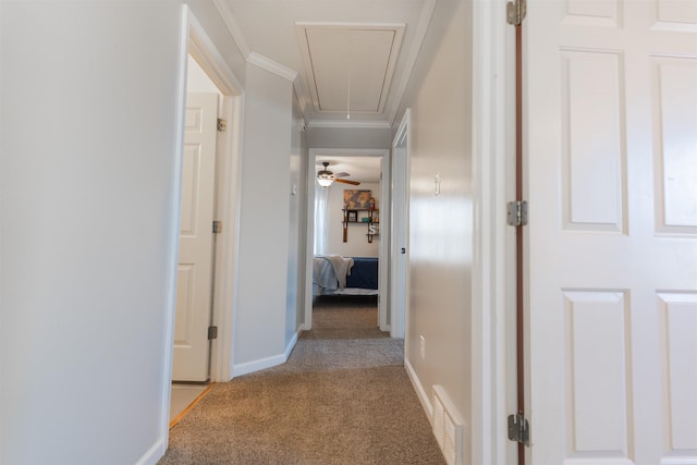 hall with light carpet and crown molding