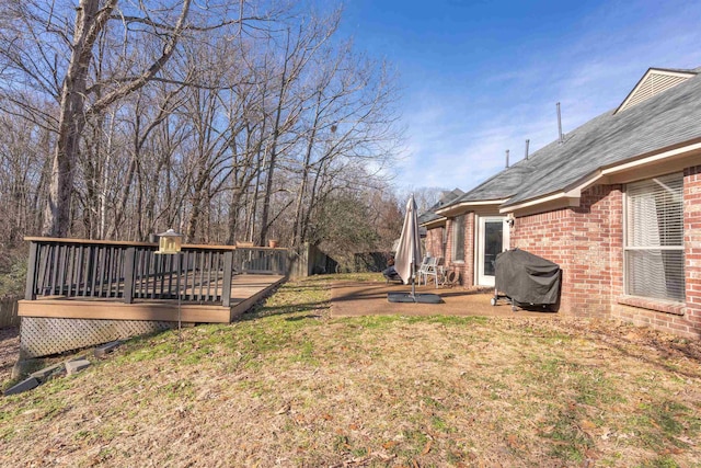 view of yard with a wooden deck