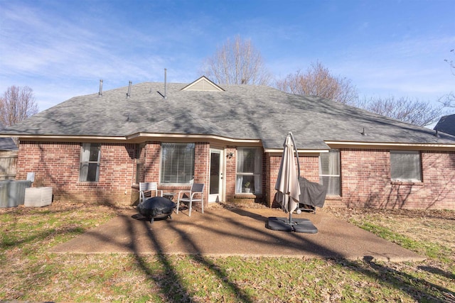 back of house with central AC unit and a patio area