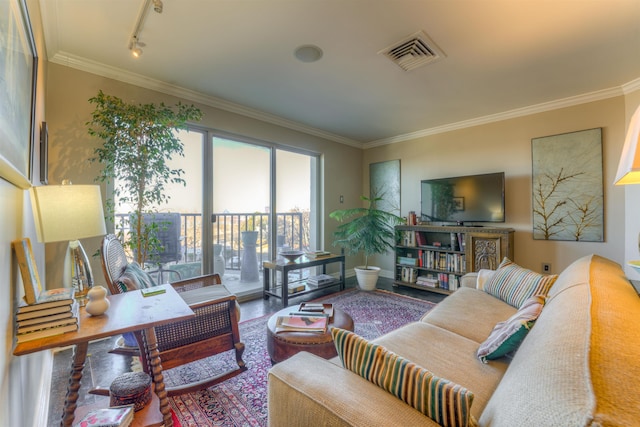 living room with track lighting, hardwood / wood-style floors, and ornamental molding