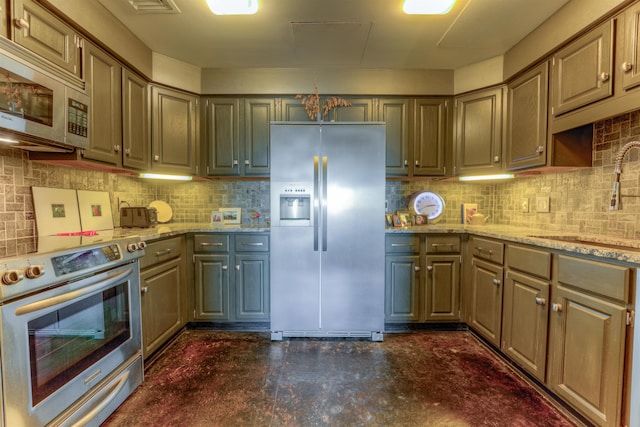 kitchen with sink, stainless steel appliances, light stone counters, and backsplash