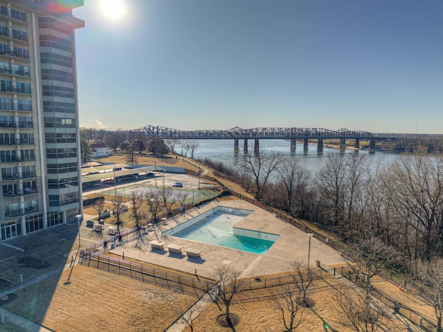 view of swimming pool with a water view