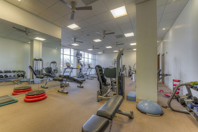 exercise room featuring ceiling fan and expansive windows