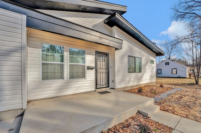 property entrance featuring a patio area