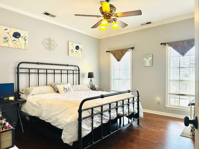 bedroom featuring ceiling fan, ornamental molding, and dark hardwood / wood-style flooring