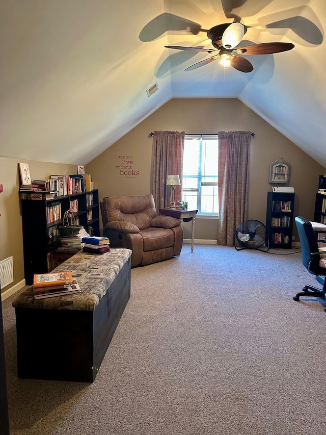 carpeted living room featuring ceiling fan and lofted ceiling