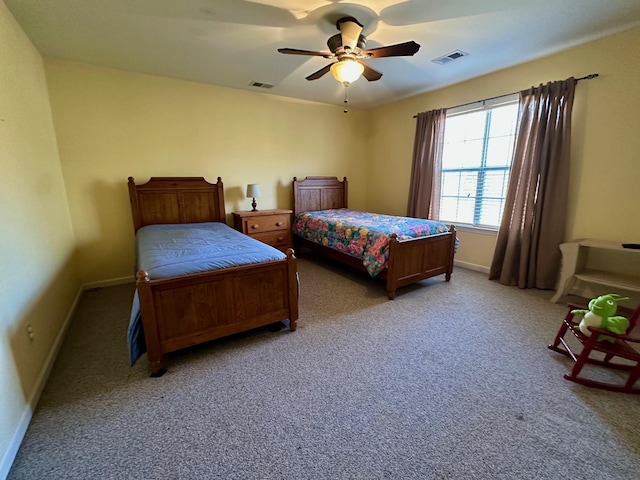 bedroom featuring light carpet and ceiling fan