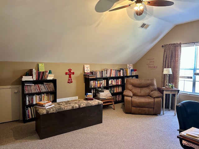 office area featuring ceiling fan, carpet floors, and lofted ceiling