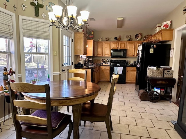 tiled dining area with an inviting chandelier