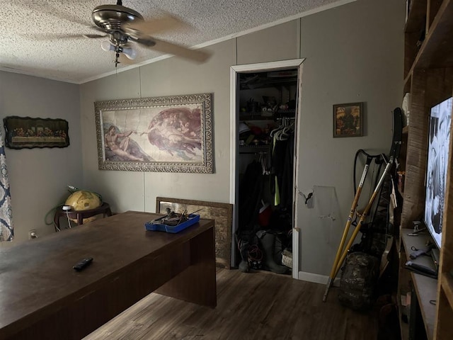 home office with ceiling fan, ornamental molding, hardwood / wood-style floors, and a textured ceiling