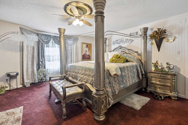 carpeted bedroom featuring a textured ceiling and ceiling fan