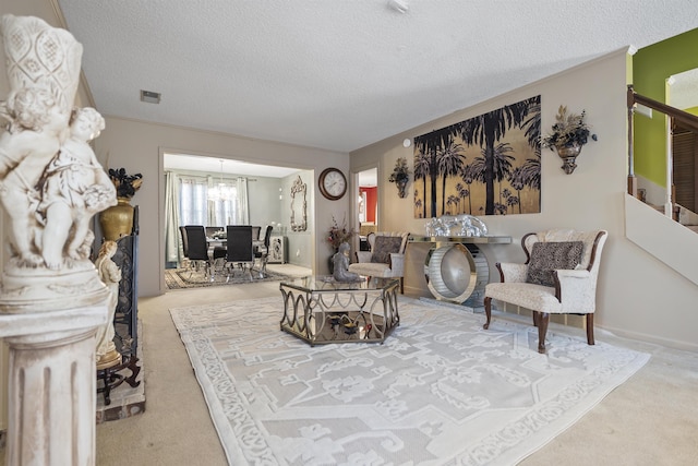 living room featuring a textured ceiling and carpet