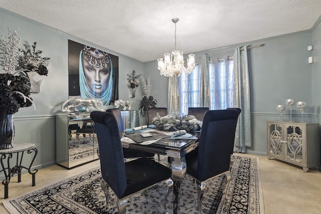 dining area with a chandelier, light colored carpet, crown molding, and a textured ceiling