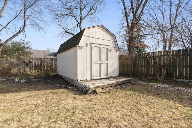 view of outbuilding featuring a lawn