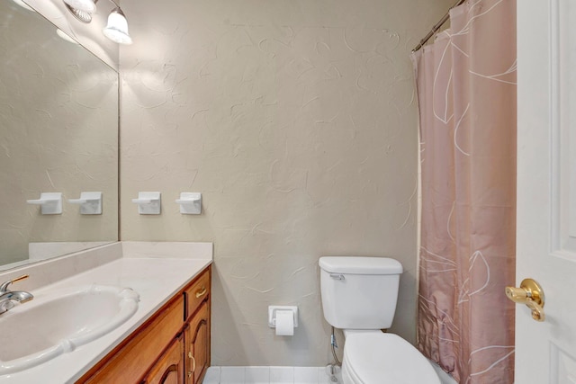 bathroom featuring vanity, toilet, and a shower with shower curtain