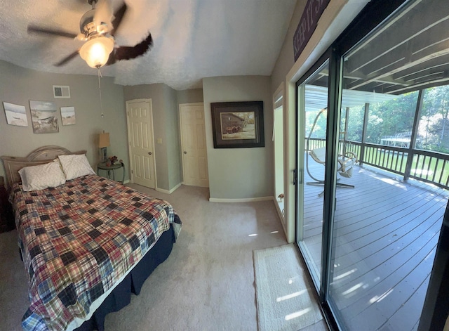 carpeted bedroom with ceiling fan and access to outside