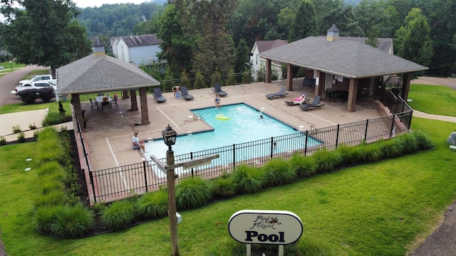 view of swimming pool with a patio area, a gazebo, and a lawn