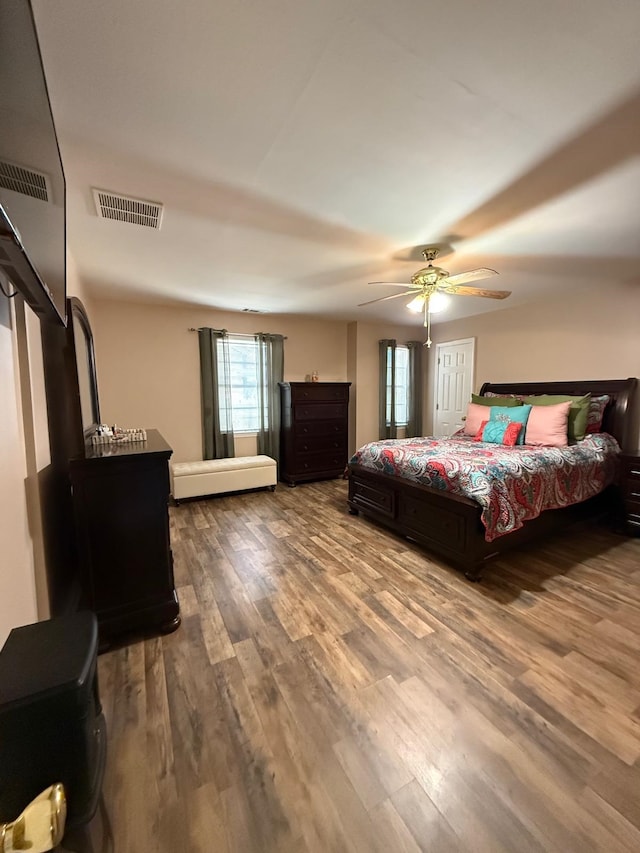 bedroom featuring ceiling fan and wood-type flooring