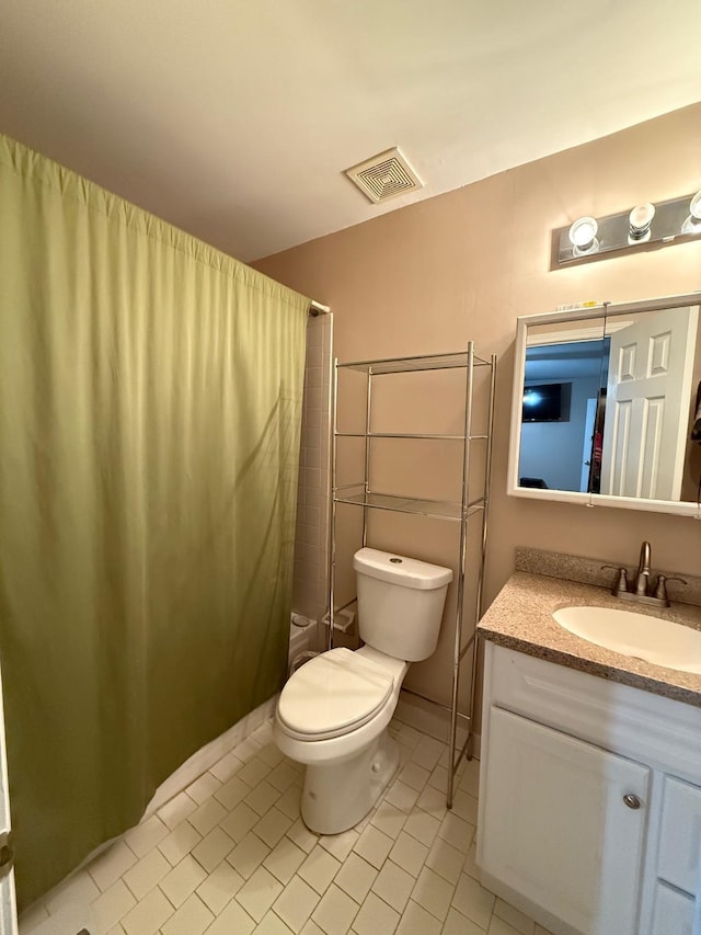 bathroom featuring toilet, tile patterned flooring, a shower with shower curtain, and vanity