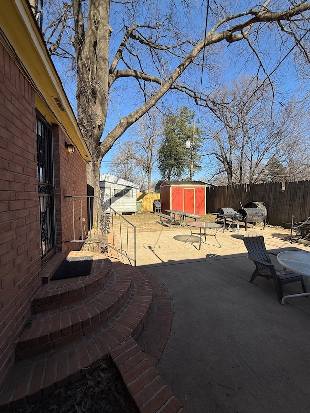 view of patio with a shed