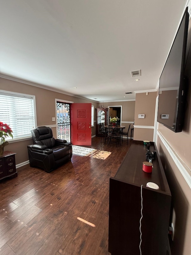 living room featuring crown molding and hardwood / wood-style floors