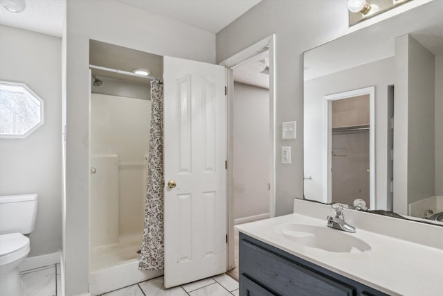 bathroom with toilet, walk in shower, tile patterned floors, and vanity