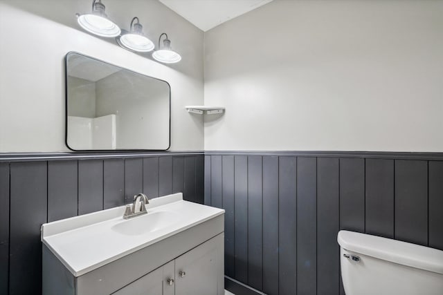 bathroom with toilet and vanity