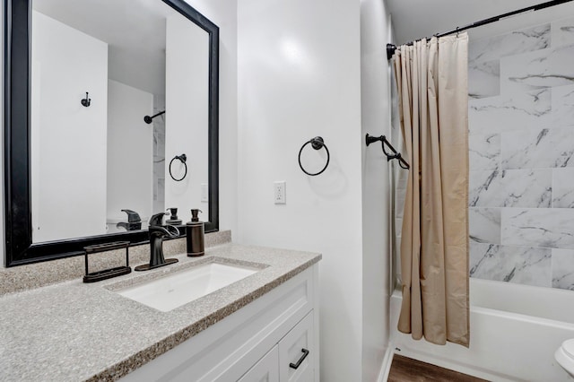 full bathroom featuring shower / tub combo, wood finished floors, and vanity