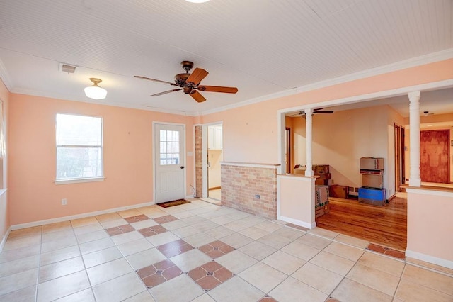 unfurnished room featuring ornamental molding, ceiling fan, ornate columns, and light tile patterned flooring