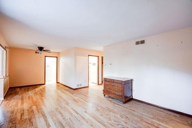 spare room with ceiling fan and light hardwood / wood-style flooring