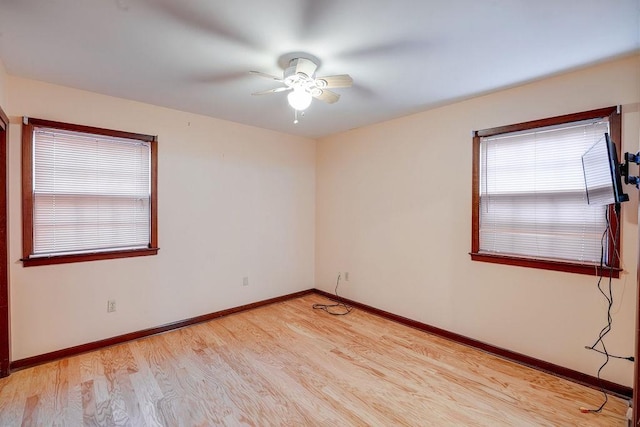 unfurnished room featuring ceiling fan and light hardwood / wood-style flooring