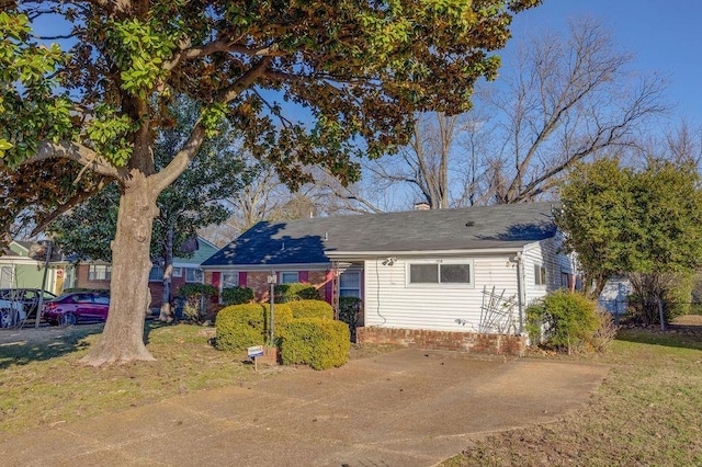 rear view of property with a yard