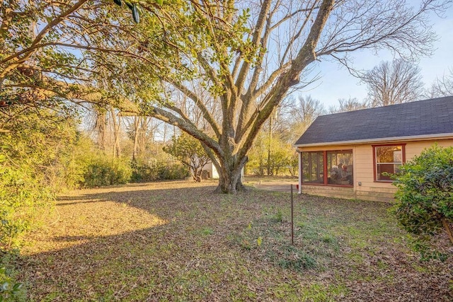 view of yard featuring a sunroom