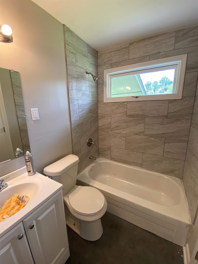 full bathroom with tiled shower / bath combo, toilet, and vanity