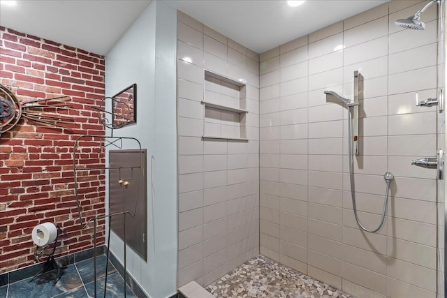 bathroom featuring a tile shower