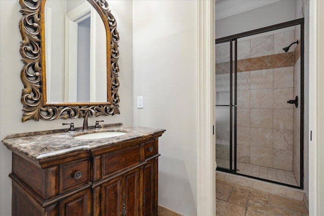 bathroom featuring vanity, walk in shower, and ornamental molding