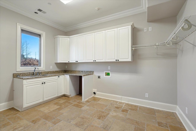 laundry area with crown molding, sink, hookup for an electric dryer, cabinets, and washer hookup