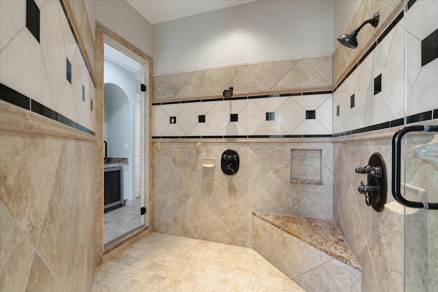 bathroom with tiled shower