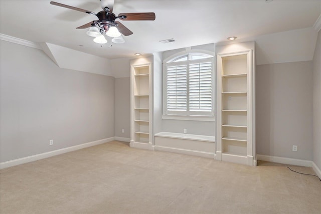 unfurnished bedroom with light carpet, lofted ceiling, and ceiling fan