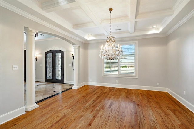 interior space with crown molding, coffered ceiling, decorative columns, and beam ceiling