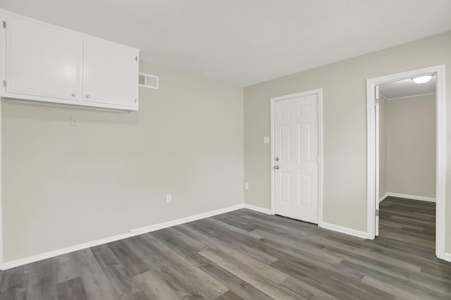 spare room with dark hardwood / wood-style floors