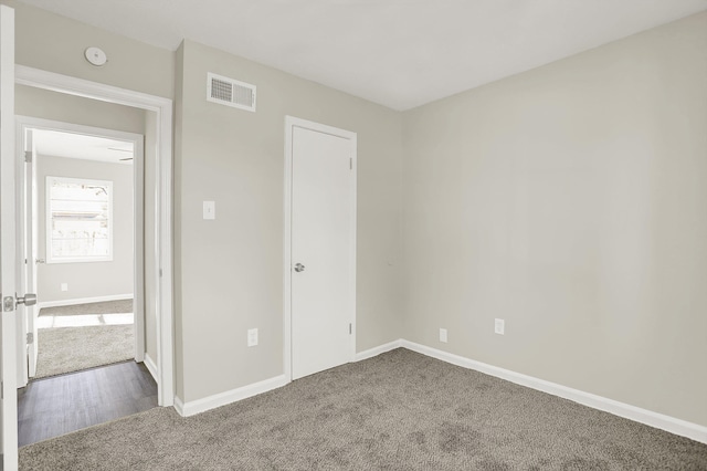 unfurnished bedroom with carpet floors